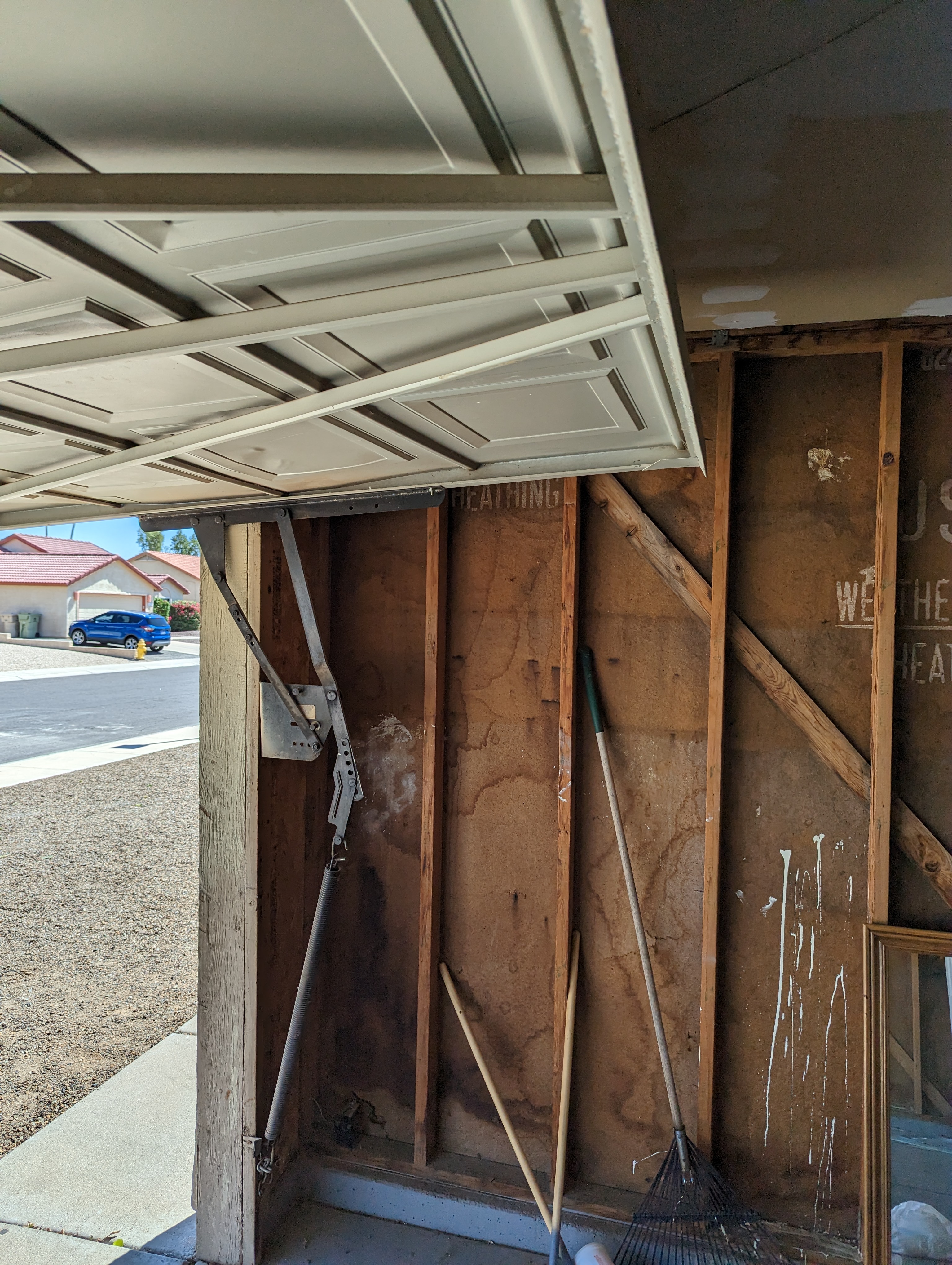 Garage door track realignment by Hinged Overhead Door