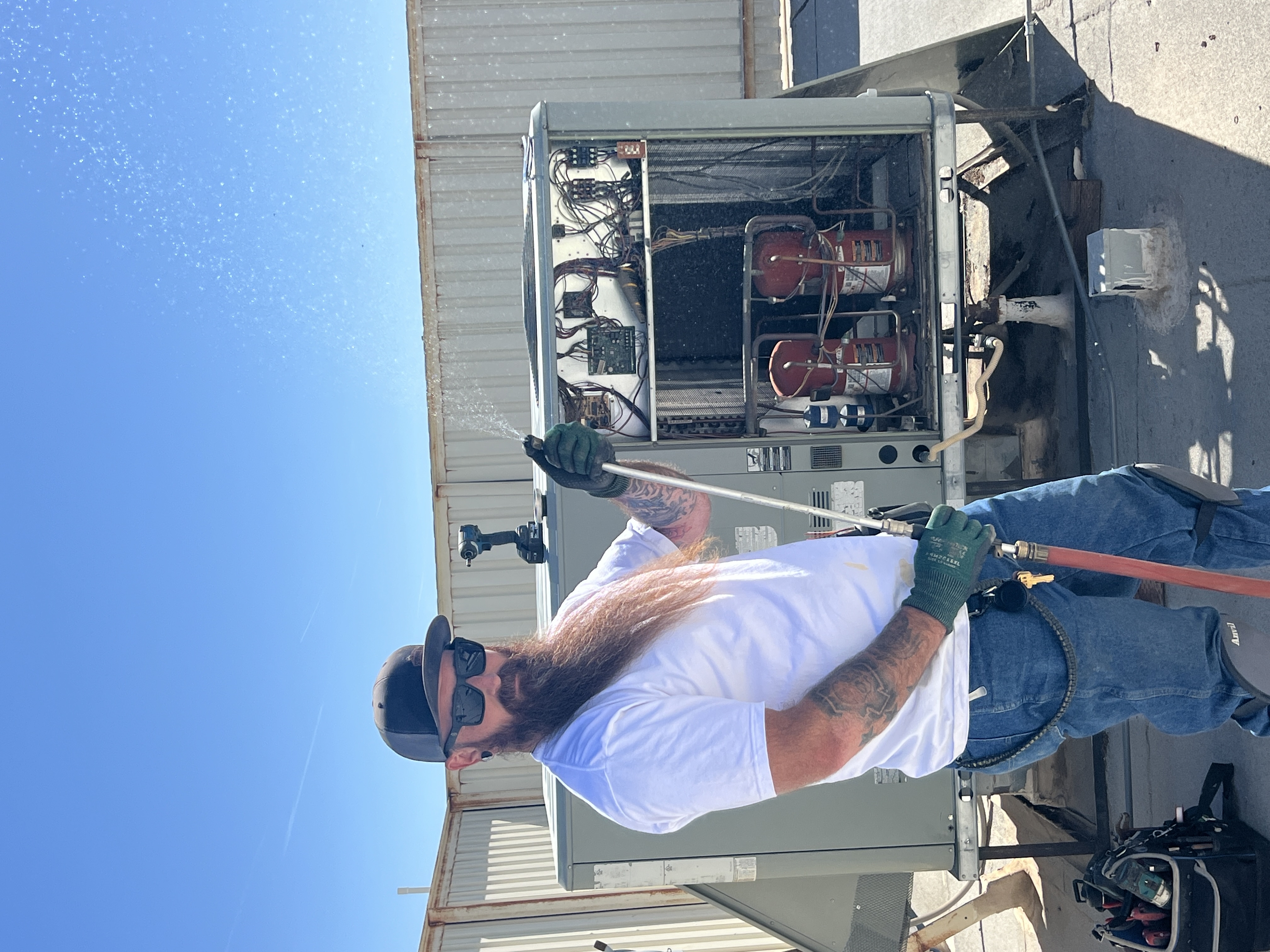 Alpha Home Services technician speaking with a Southern Arizona homeowner