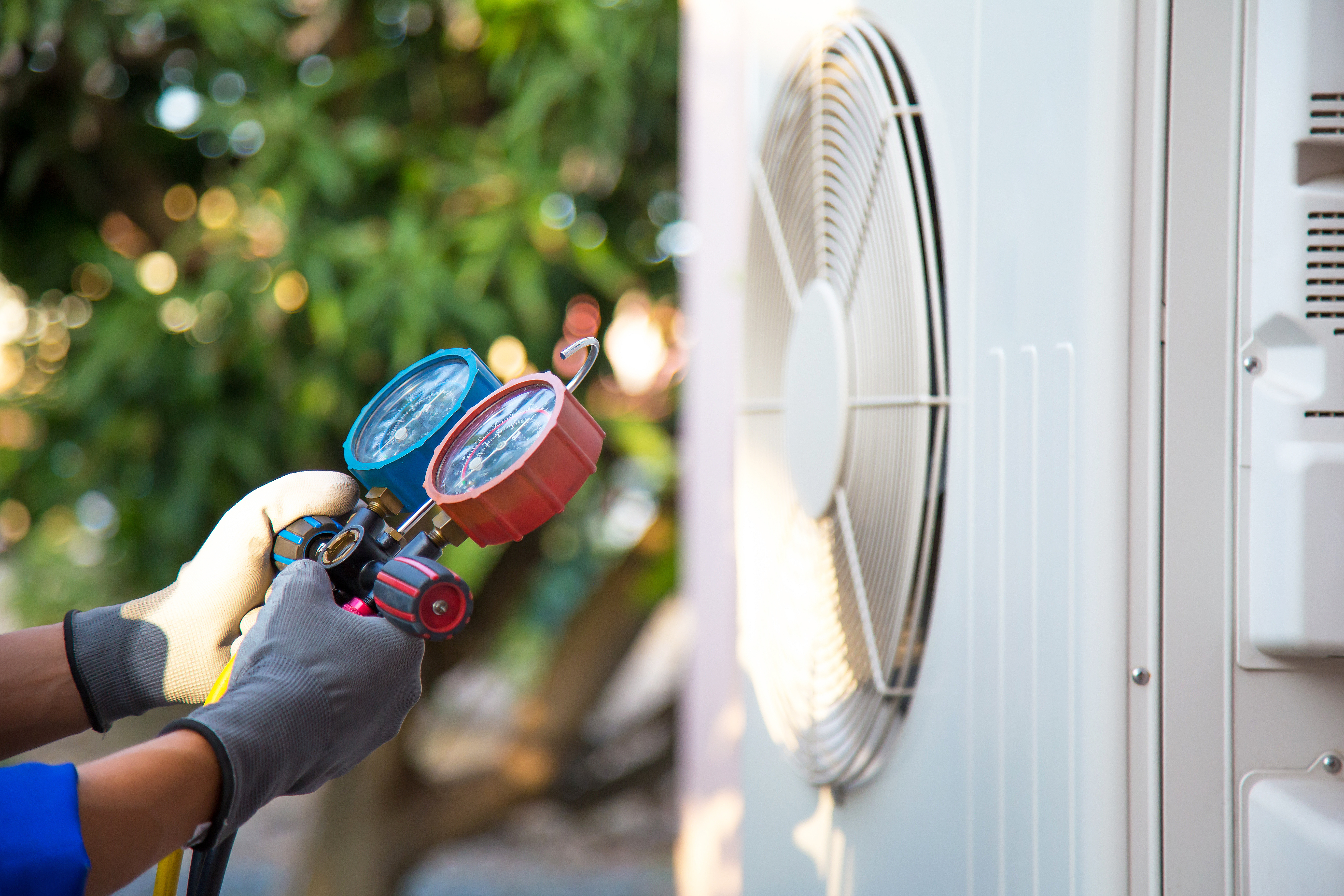 HVAC technician performing AC repair