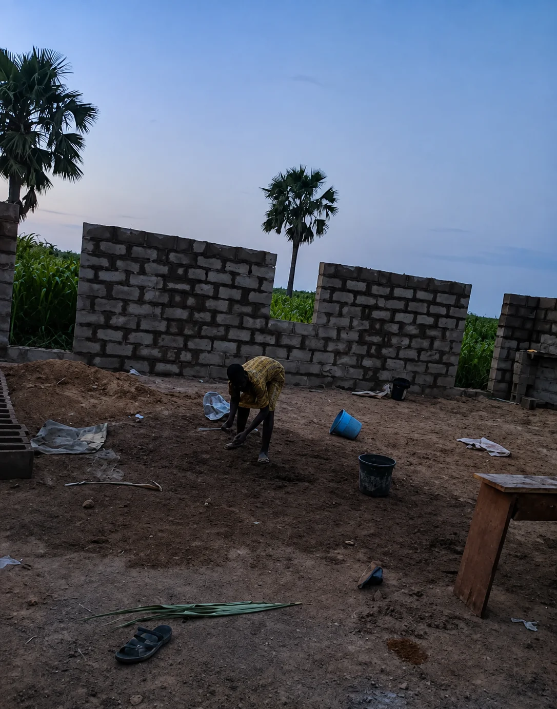 Preparing the ground inside the walls of the church building under construction in Kaduna State, Nigeria