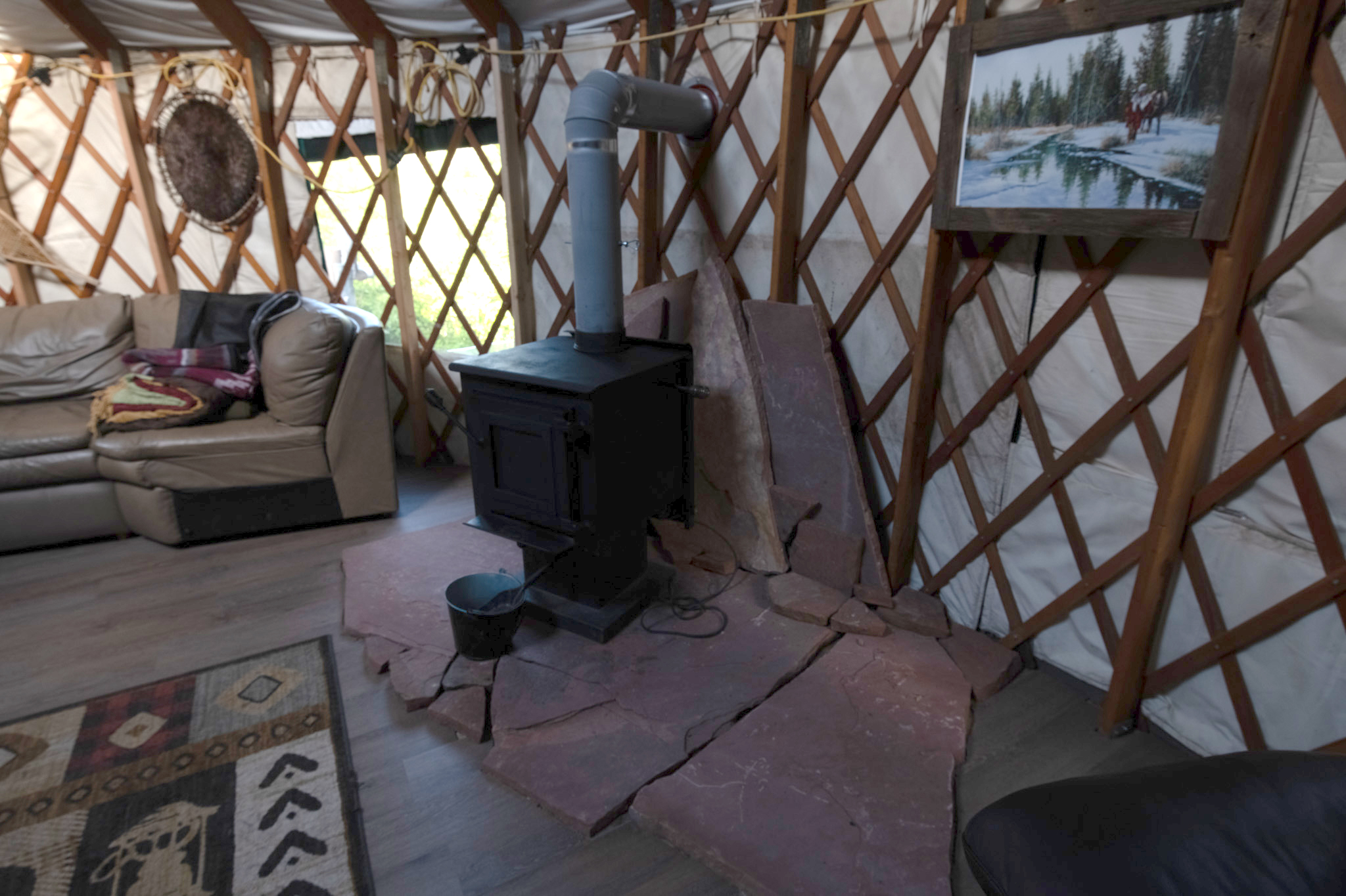 Inside the yurt — wood stove and living area