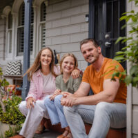 Family outside their new home