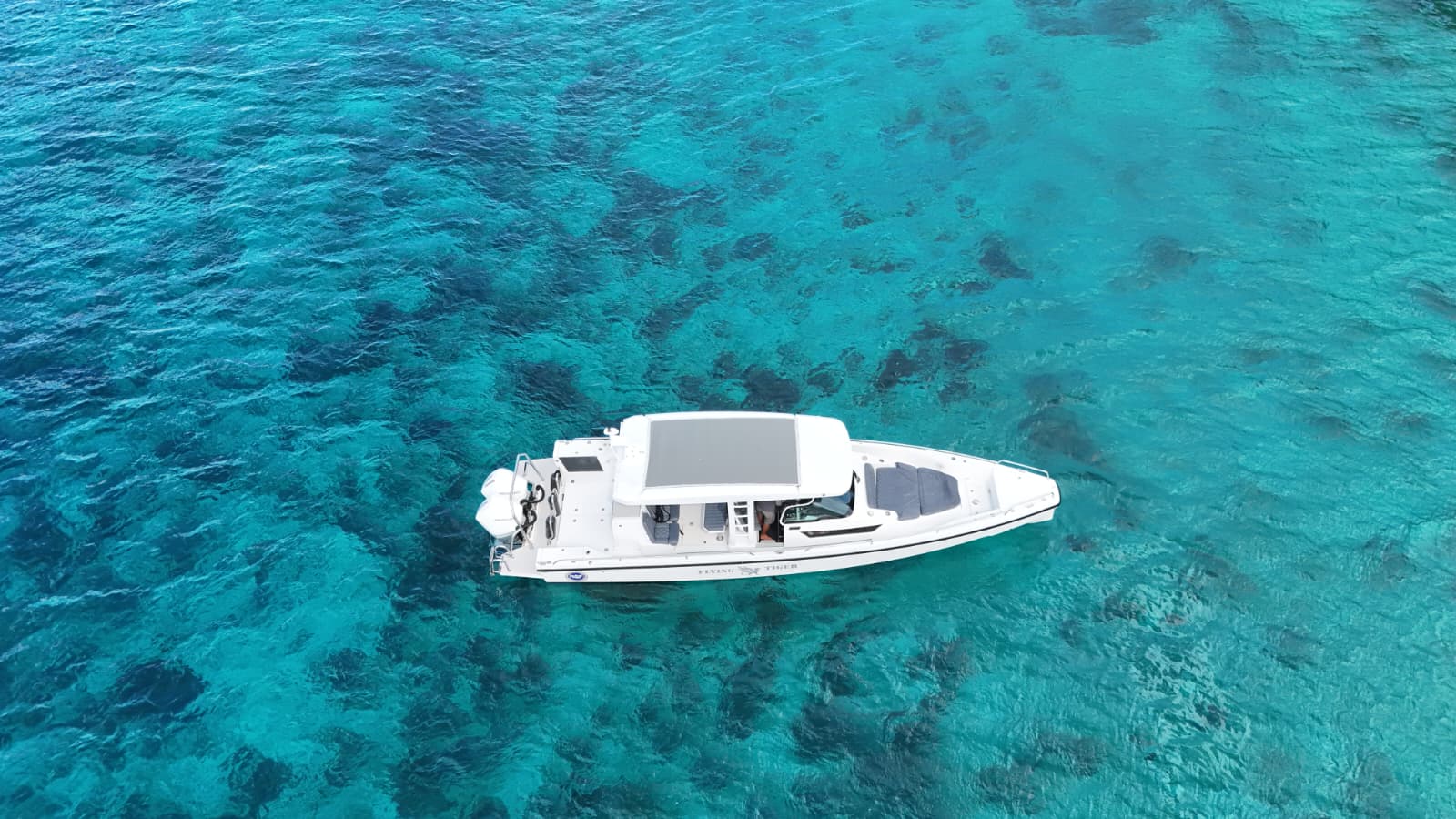 Aerial view of Flying Tiger boat in turquoise water
