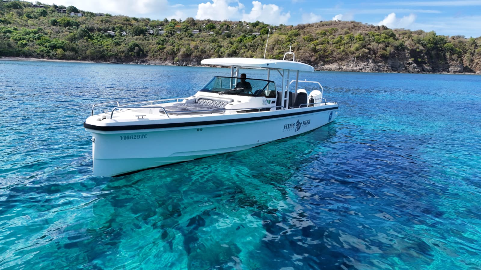 Flying Tiger boat cruising through clear blue water