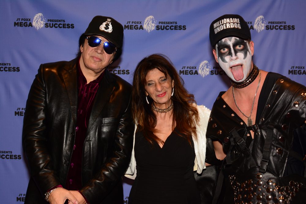 Dr. Dalal Akoury poses with KISS legend Gene Simmons at an industry event