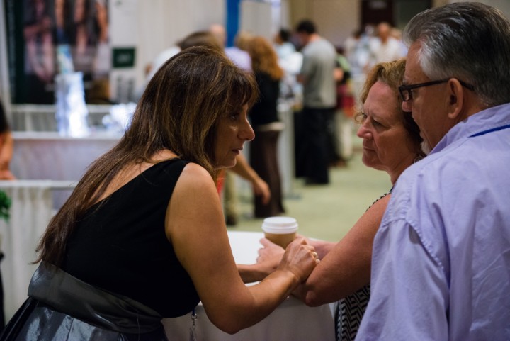 Guests in a warm, close conversation at a health conference