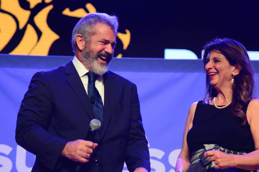 Dr. Dalal Akoury shares a laugh with actor and director Mel Gibson at an industry event