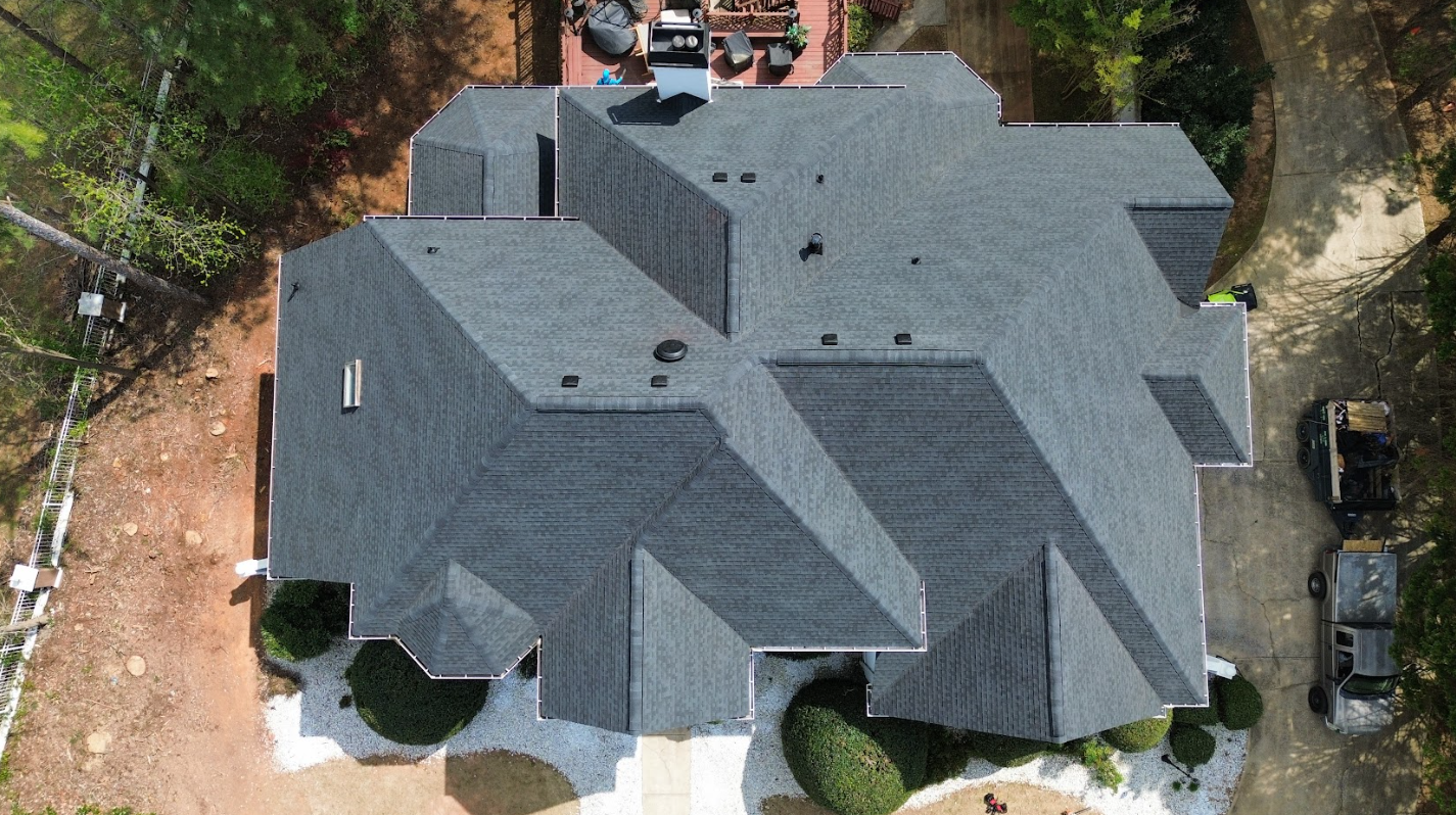 Aerial view of a completed full roof replacement in Henry County