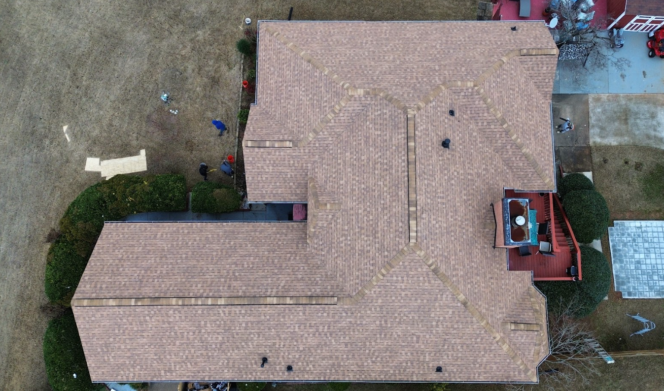 Aerial drone view of a fully-replaced asphalt roof completed by CW2 Renovations