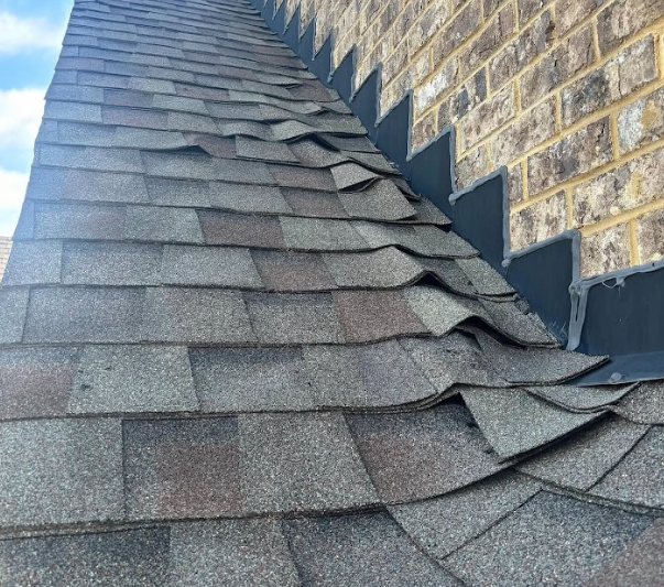 Storm-damaged shingles documented for insurance claim