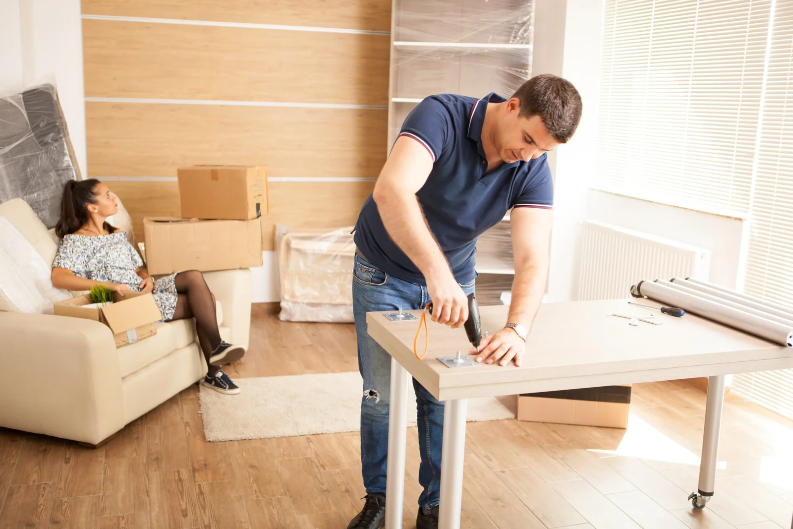 B&Z movers preparing furniture for transport