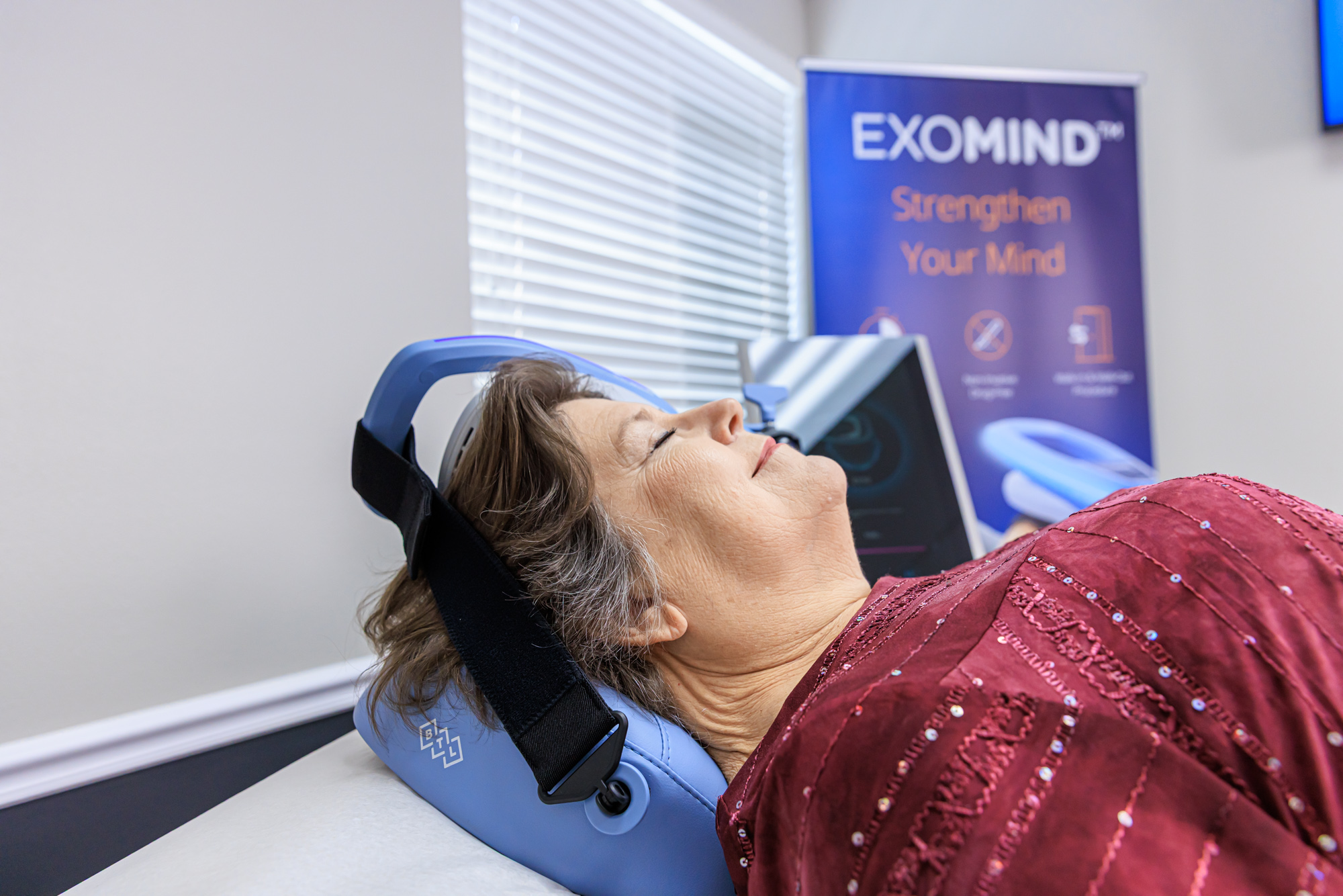 Patient receiving EXOMIND brain stimulation therapy at COGNITIVA Brain Health, Boca Raton, FL
