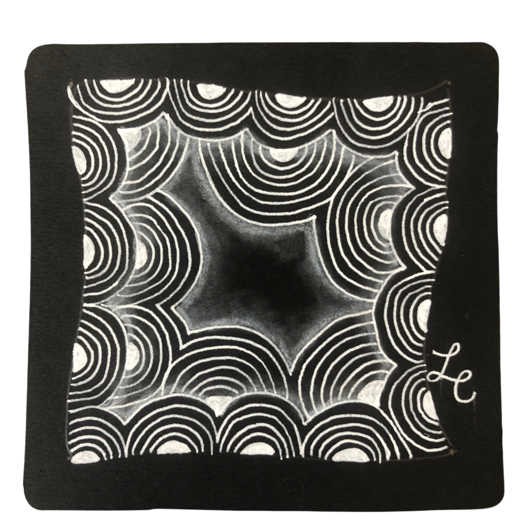 A black tile with the Crescent Moon tangle drawn on it.