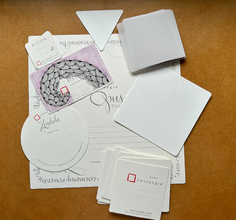 A selection of Zentangle tiles in a range of shapes and sizes.