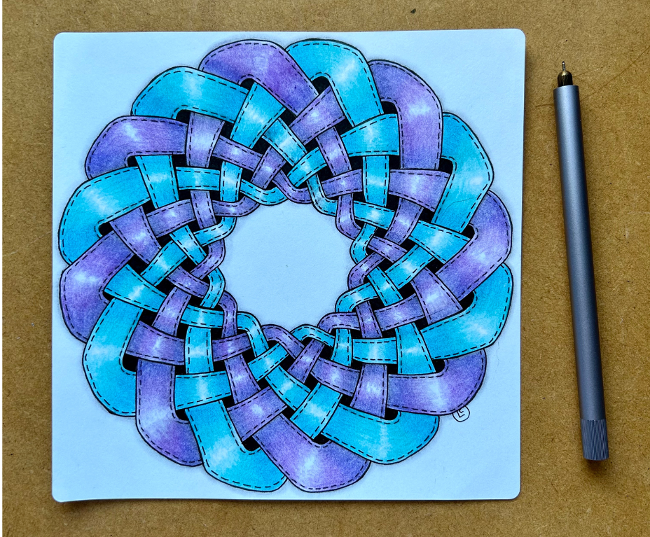 A Celtic knots project sitting on a desk, next to a Lumos pen. A Celtic knots project sitting on a desk, next to a Lumos pen.