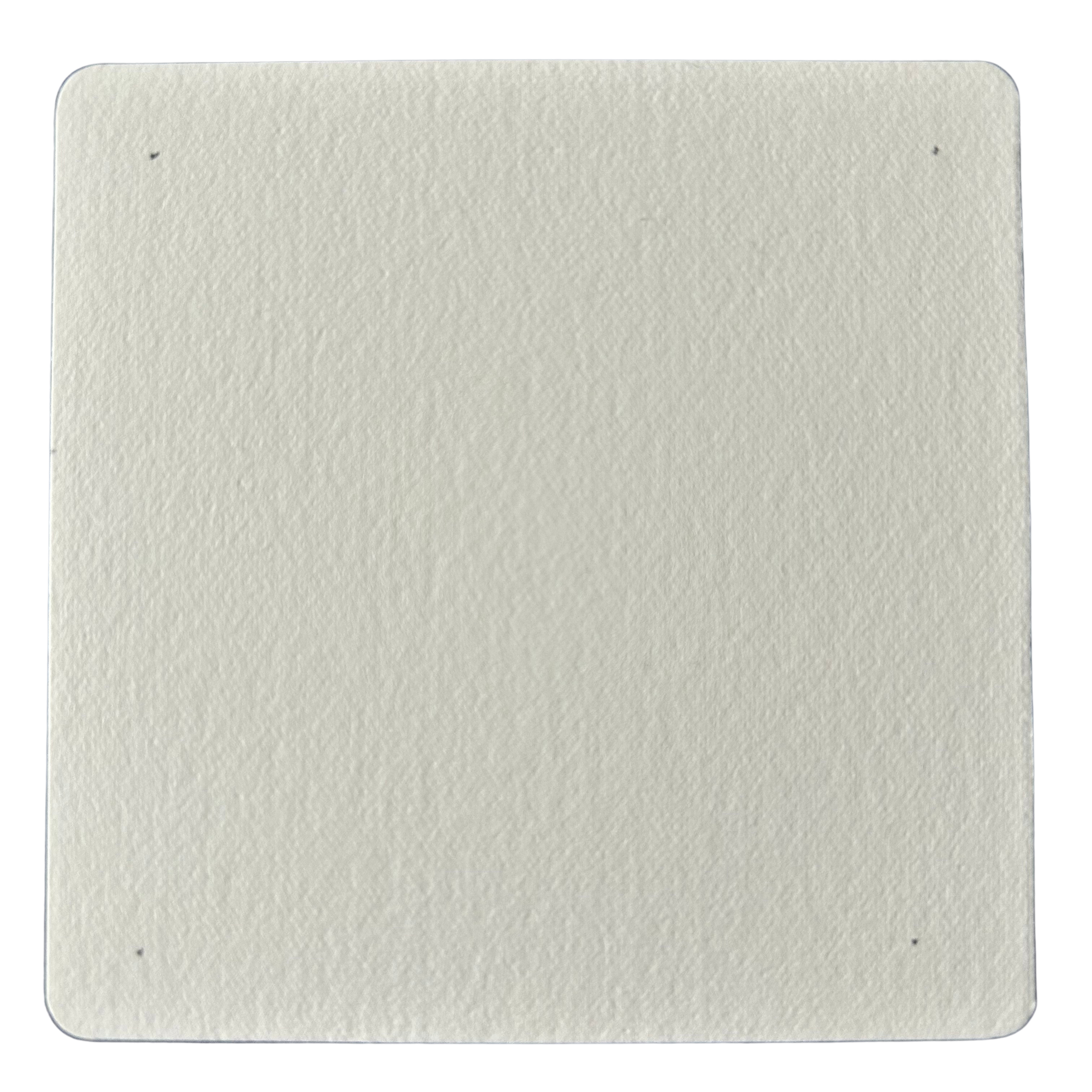 A small paper tile with dots pencilled lightly in the corners