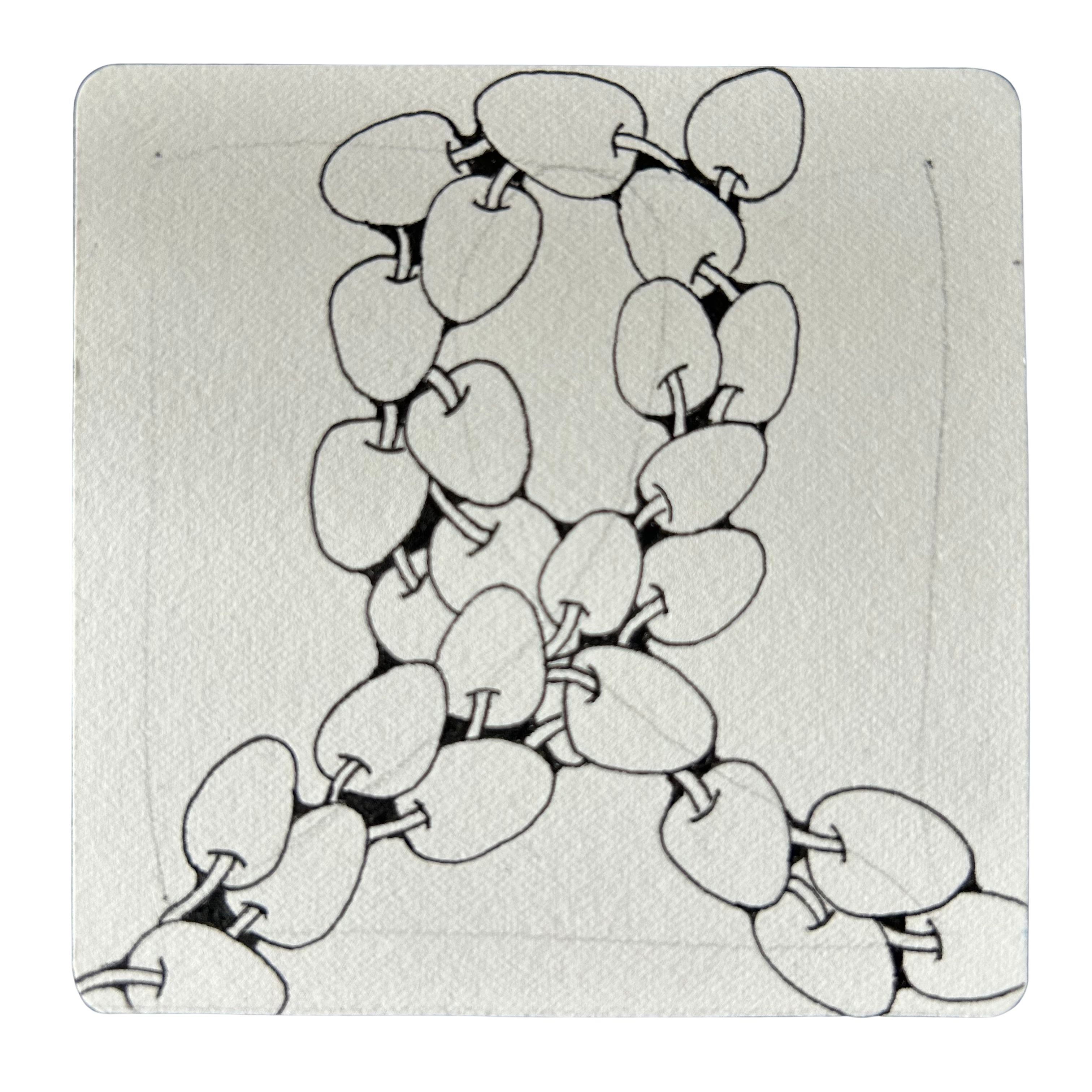 Small paper tile with a Zentangle pattern called Poke Root drawn on it.