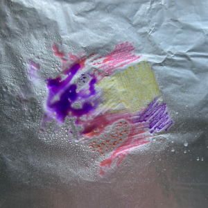 A piece of tin foil coloured with felt-tip pens ready for a map tangling project by Lisa Crow, CZT.