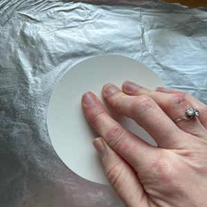 A piece of tin foil coloured with felt-tip pens and water sprayed by Lisa Crow CZT.