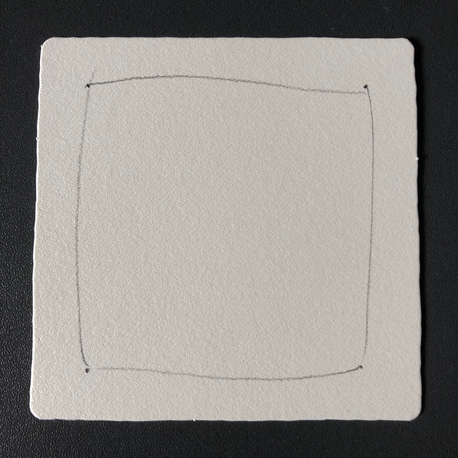 A paper tile with a pencilled border ready for tangling in. A paper tile with a pencilled border ready for tangling in.