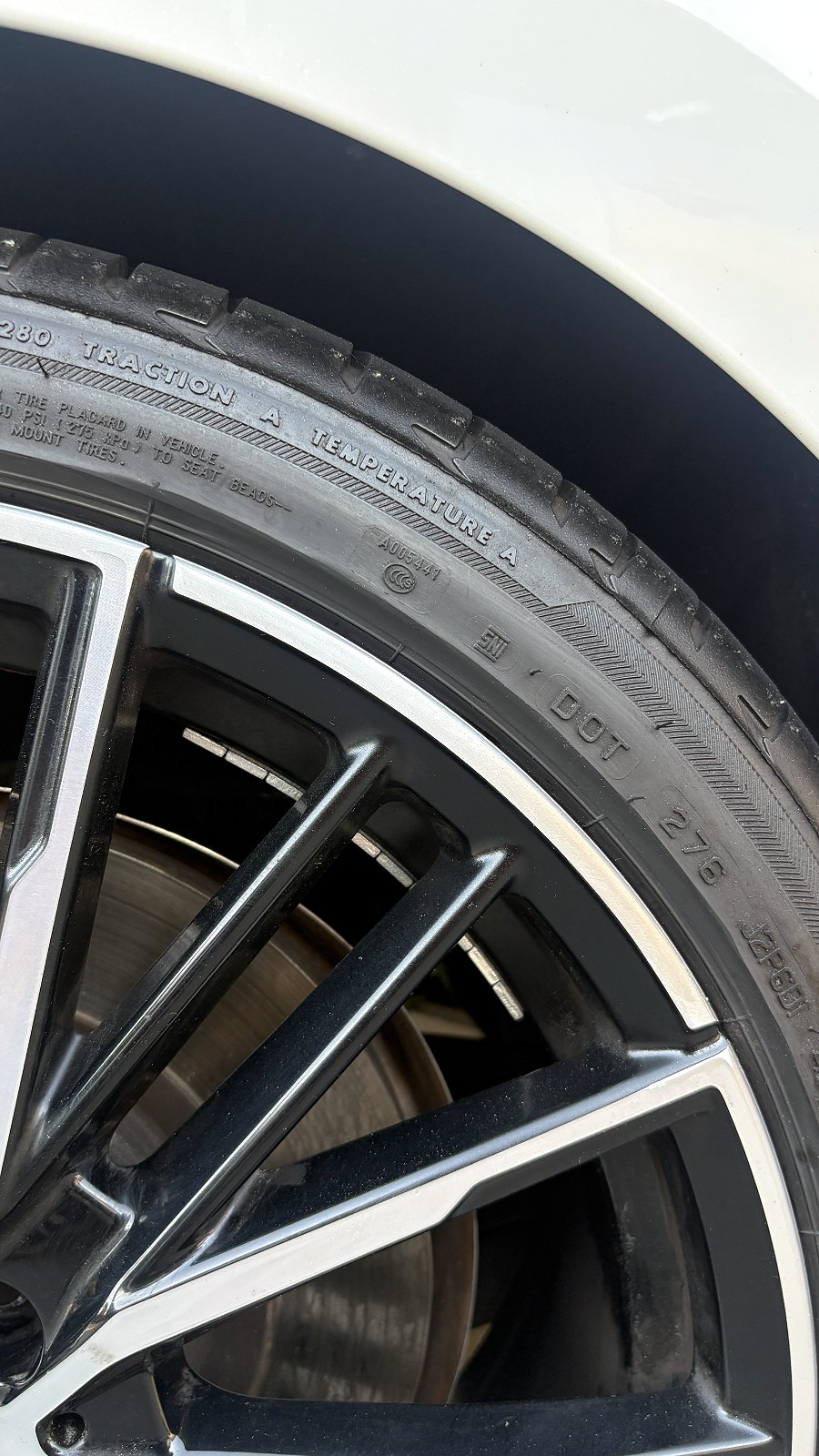 The same BMW alloy wheel after curb rash repair, machined lip refinished