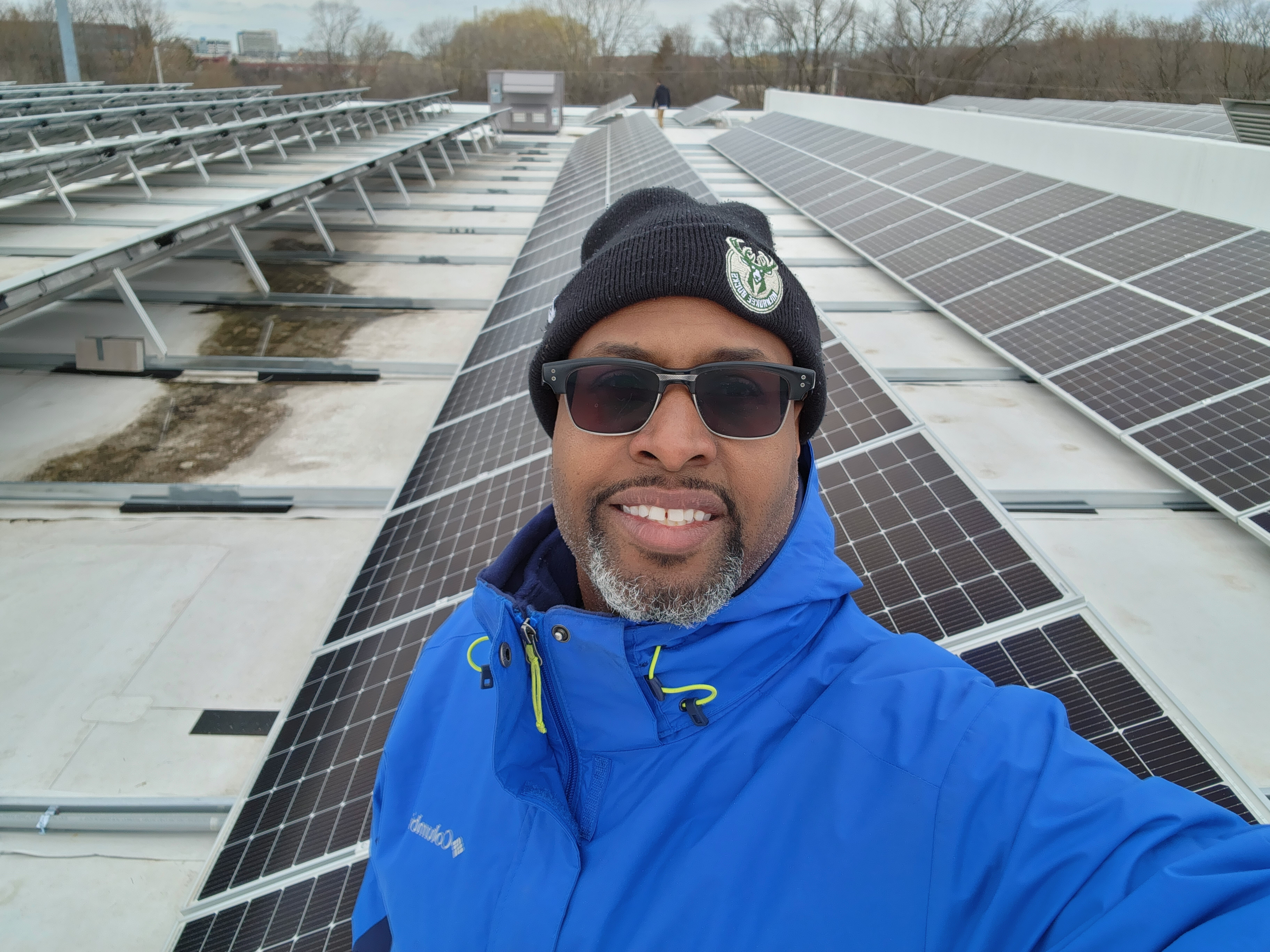 Deshea Agee on a rooftop solar array project at Outreach Community Health Center