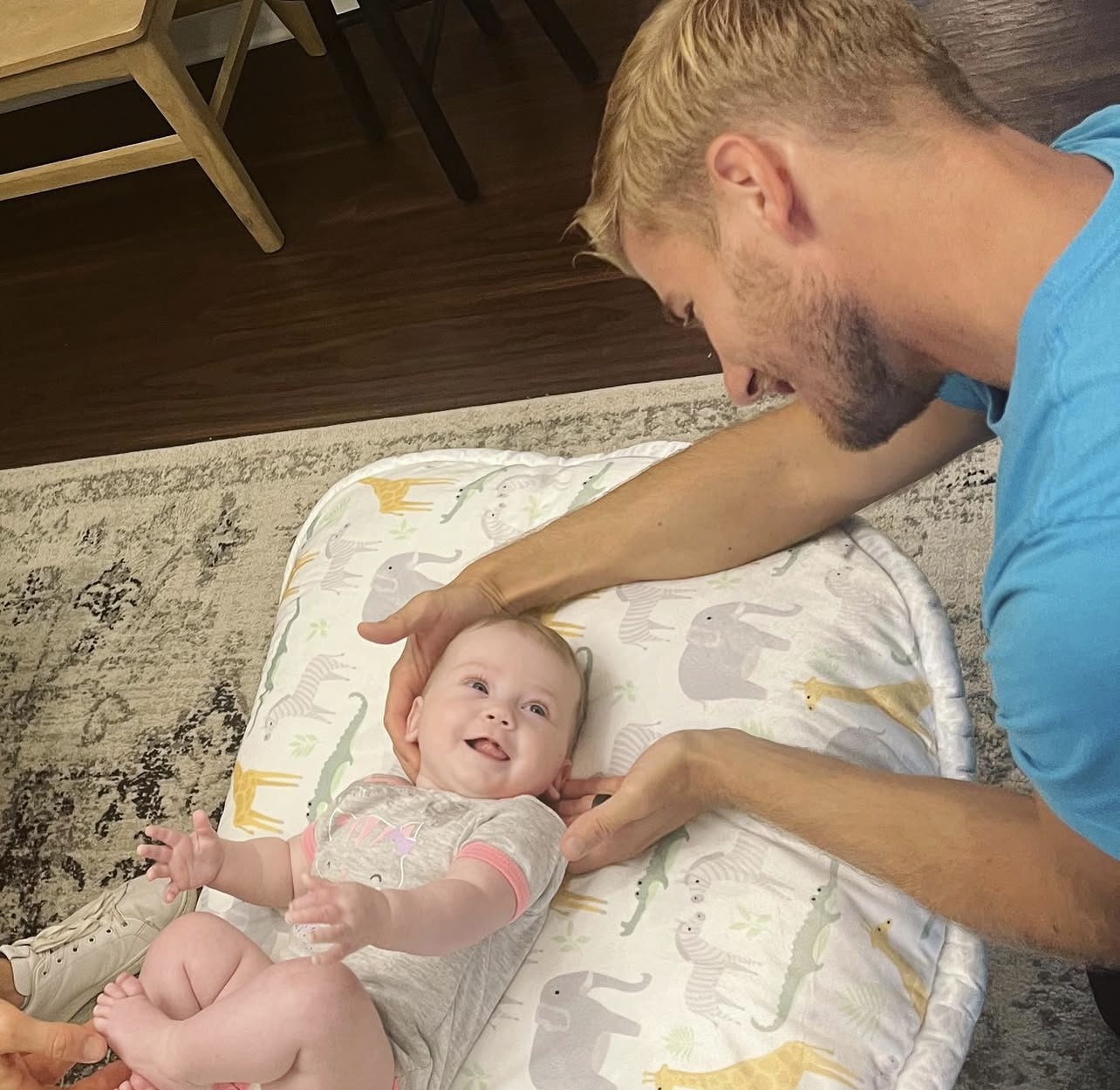 Dr. Brett adjusting a baby