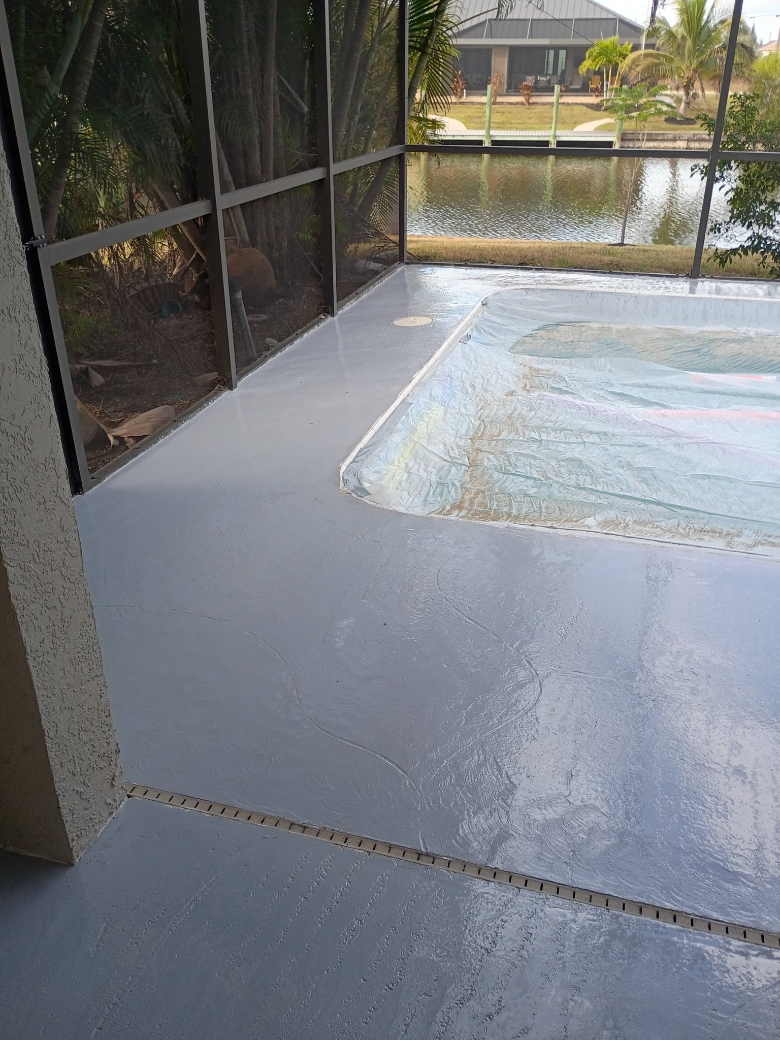 Stain and seal concrete floor with decorative color and protective sealer in Port Charlotte, FL