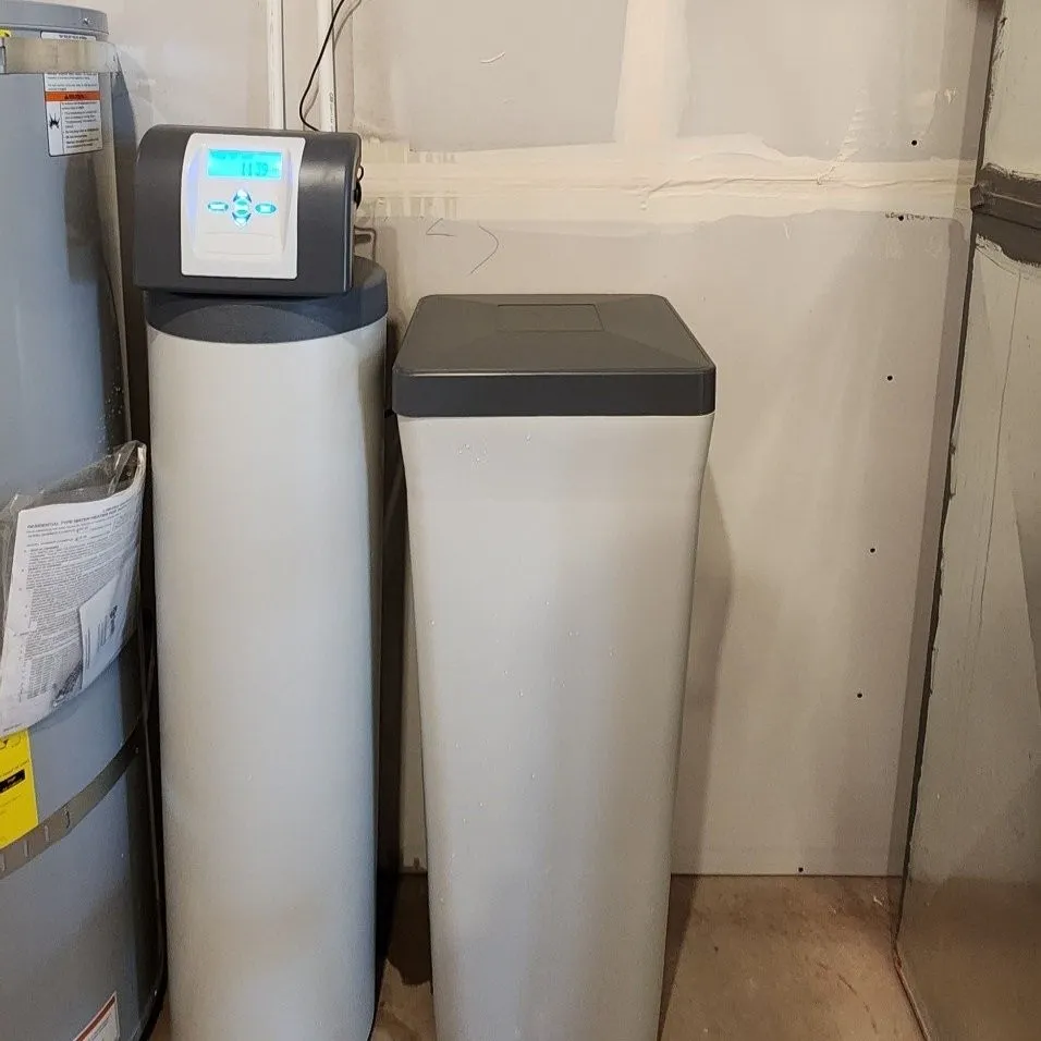 Water heater and water filtration system professionally installed in a Reading PA utility room by JB Plumbing HVAC & Construction