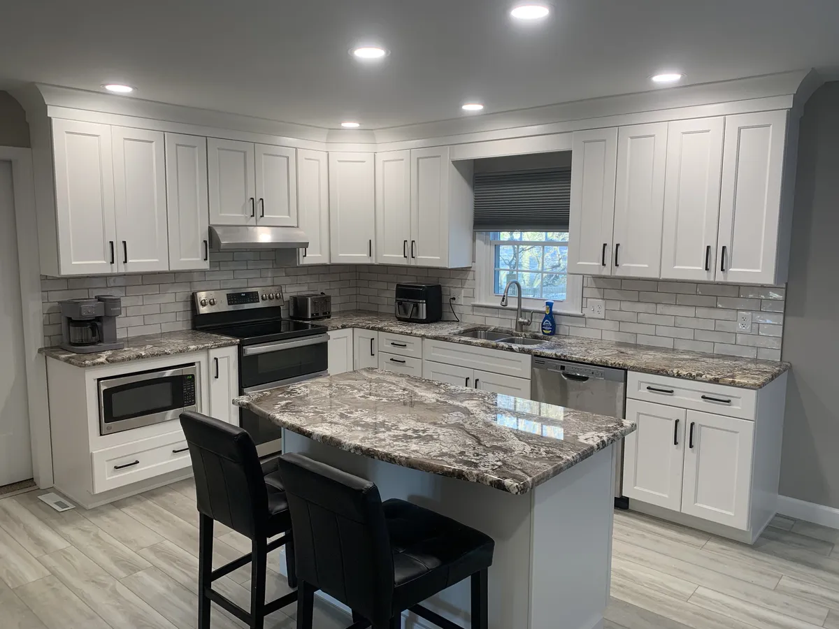 Kitchen remodel featuring white shaker cabinets, granite countertops, subway in Reading, PA by JB Plumbing HVAC & Construc...