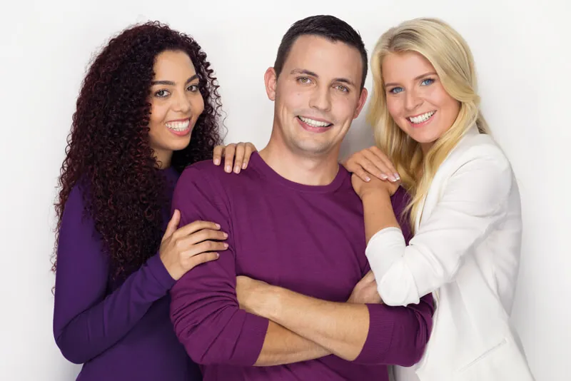 Three smiling friends, the first step towards clear aligner treatment