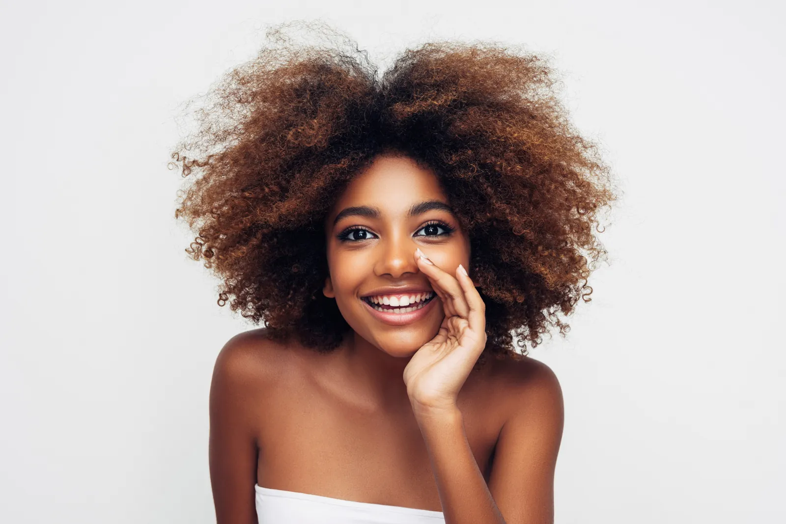 Laughing woman with natural afro hair