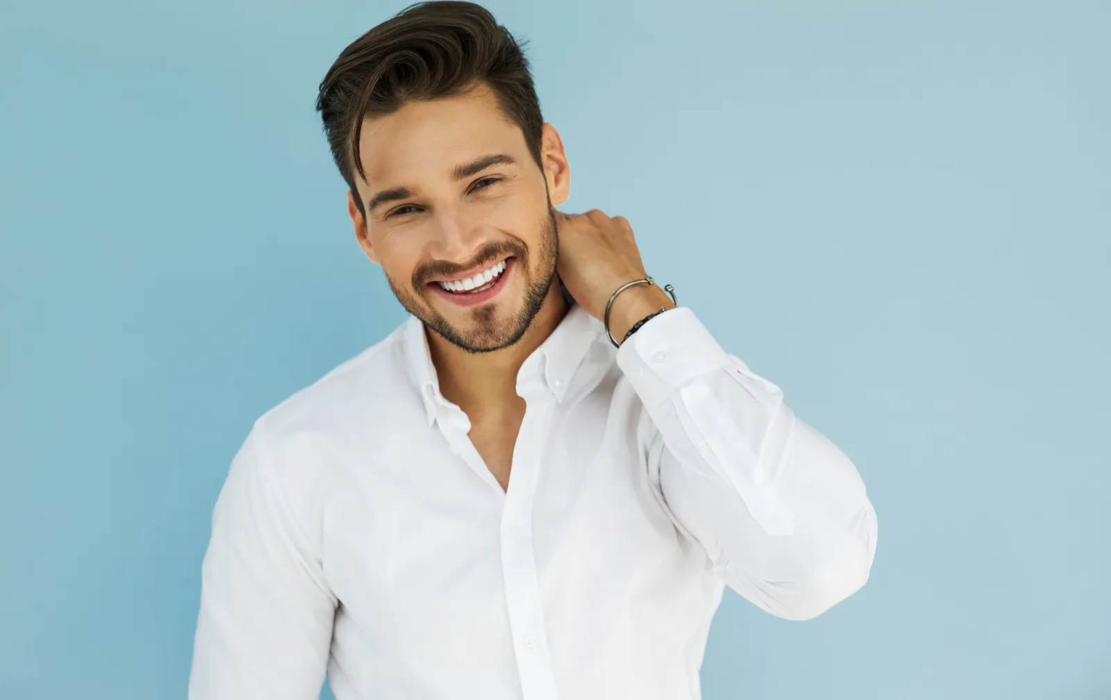 Smiling man in a white shirt