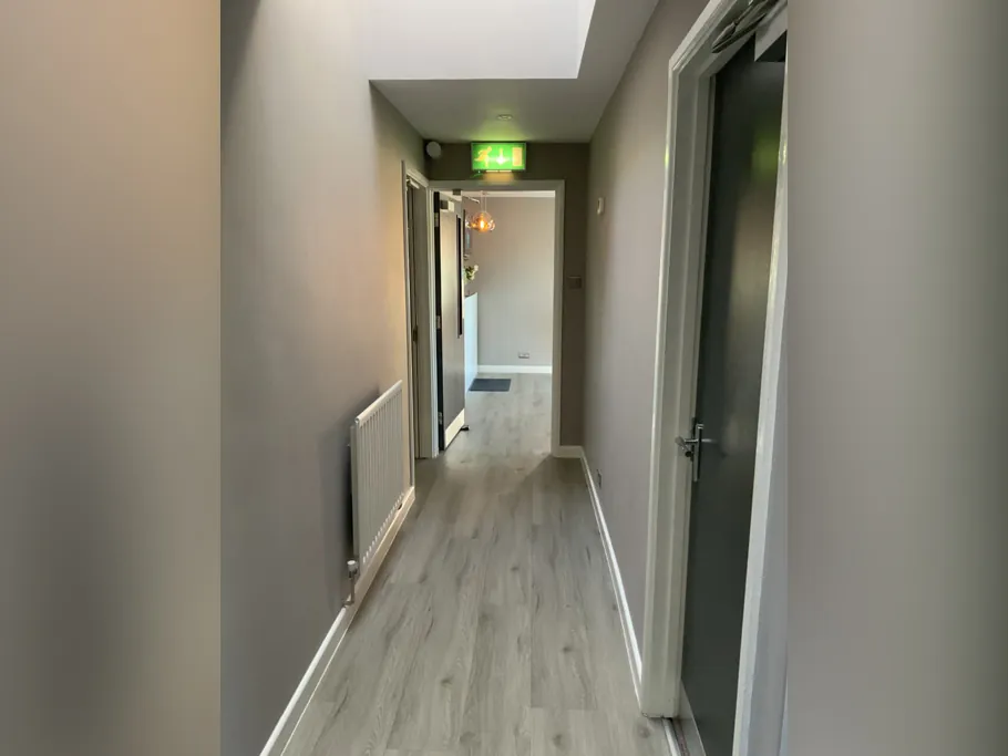 Bright corridor leading to the treatment rooms