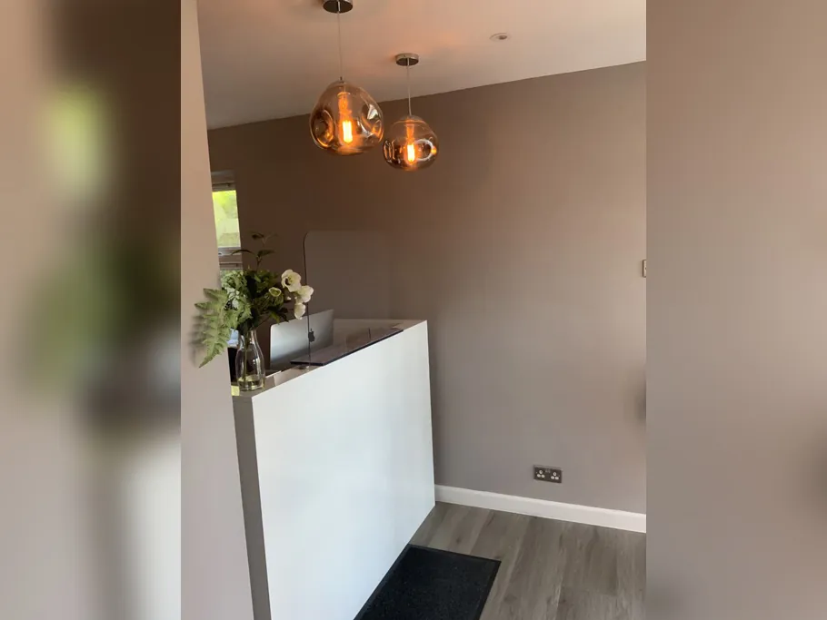Reception desk with pendant lighting at Chafford Hundred Dental Care