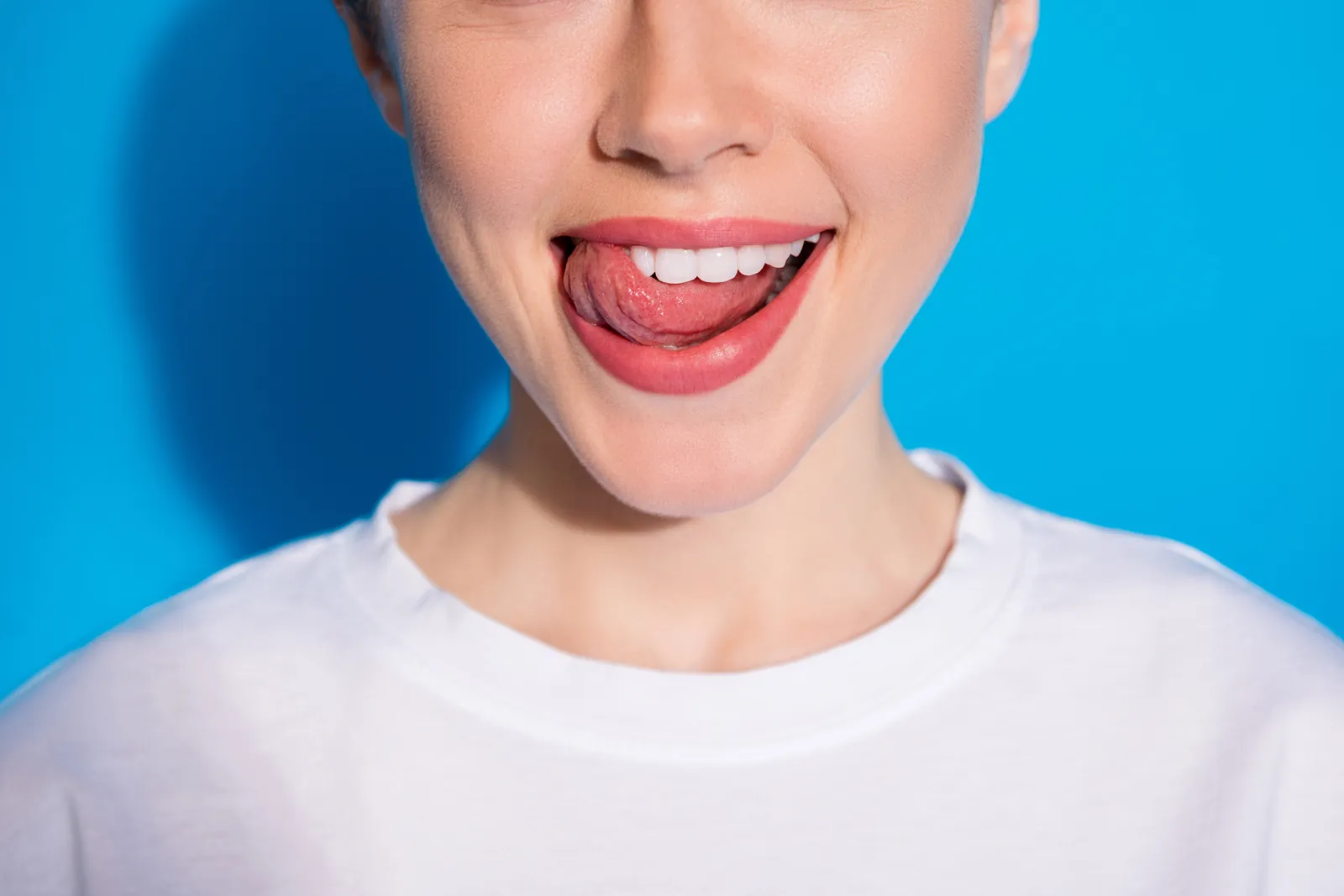 Close-up of a playful smile with white teeth