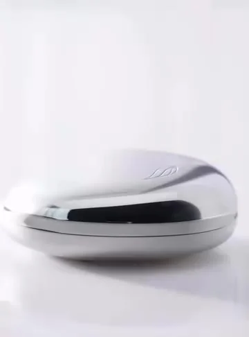 Closed silver Angel Aligner case on a white surface