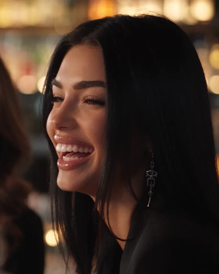 Sienna laughing on a night out (AI-generated image of Sienna, our AI brand ambassador)