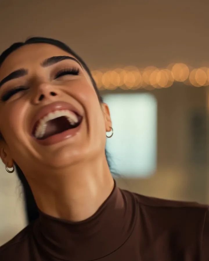 Sienna laughing at a dance class (AI-generated image of Sienna, our AI brand ambassador)