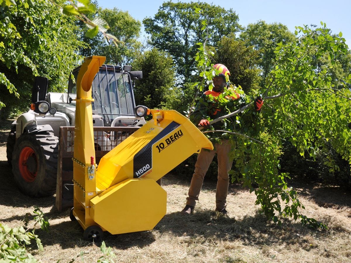 Field and Forest wood chipper and tree work image
