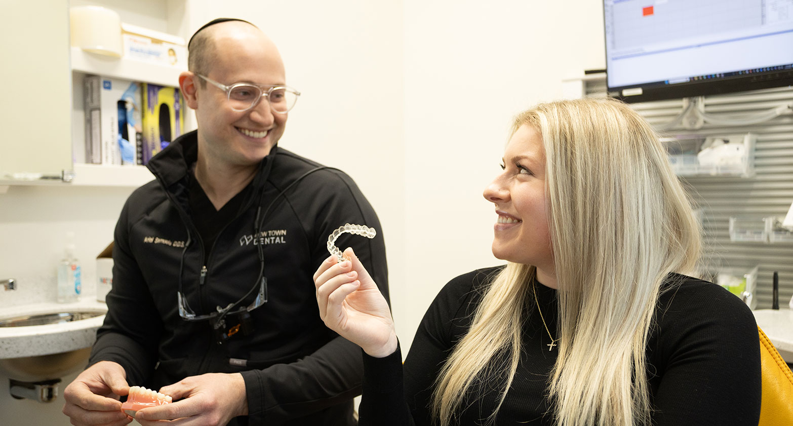 Woman holding invisalign